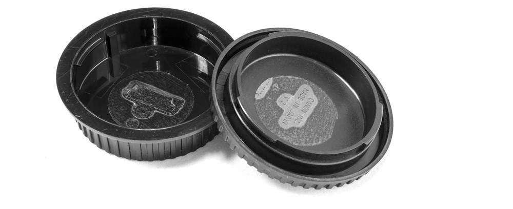 Sticky tabs on the inside of body and lens caps will help attract unwanted dust.