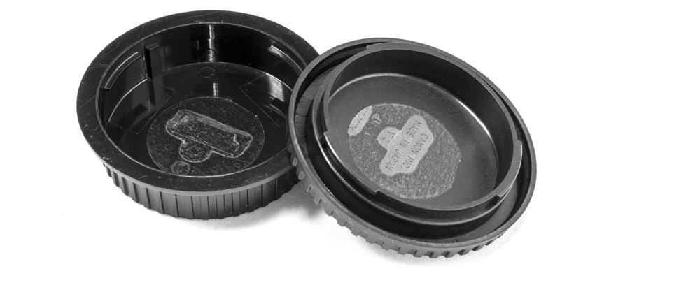 Sticky tabs on the inside of body and lens caps will help attract unwanted dust.