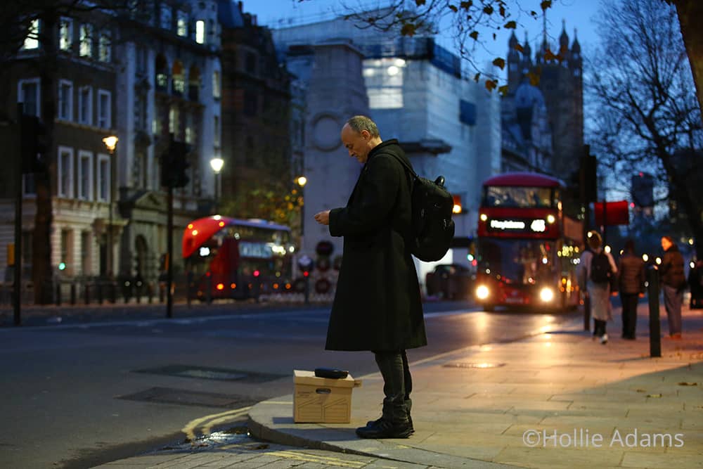 Dominic Cummings waits for a taxi on Whitehall the day he leaves downing street © Hollie Adams
