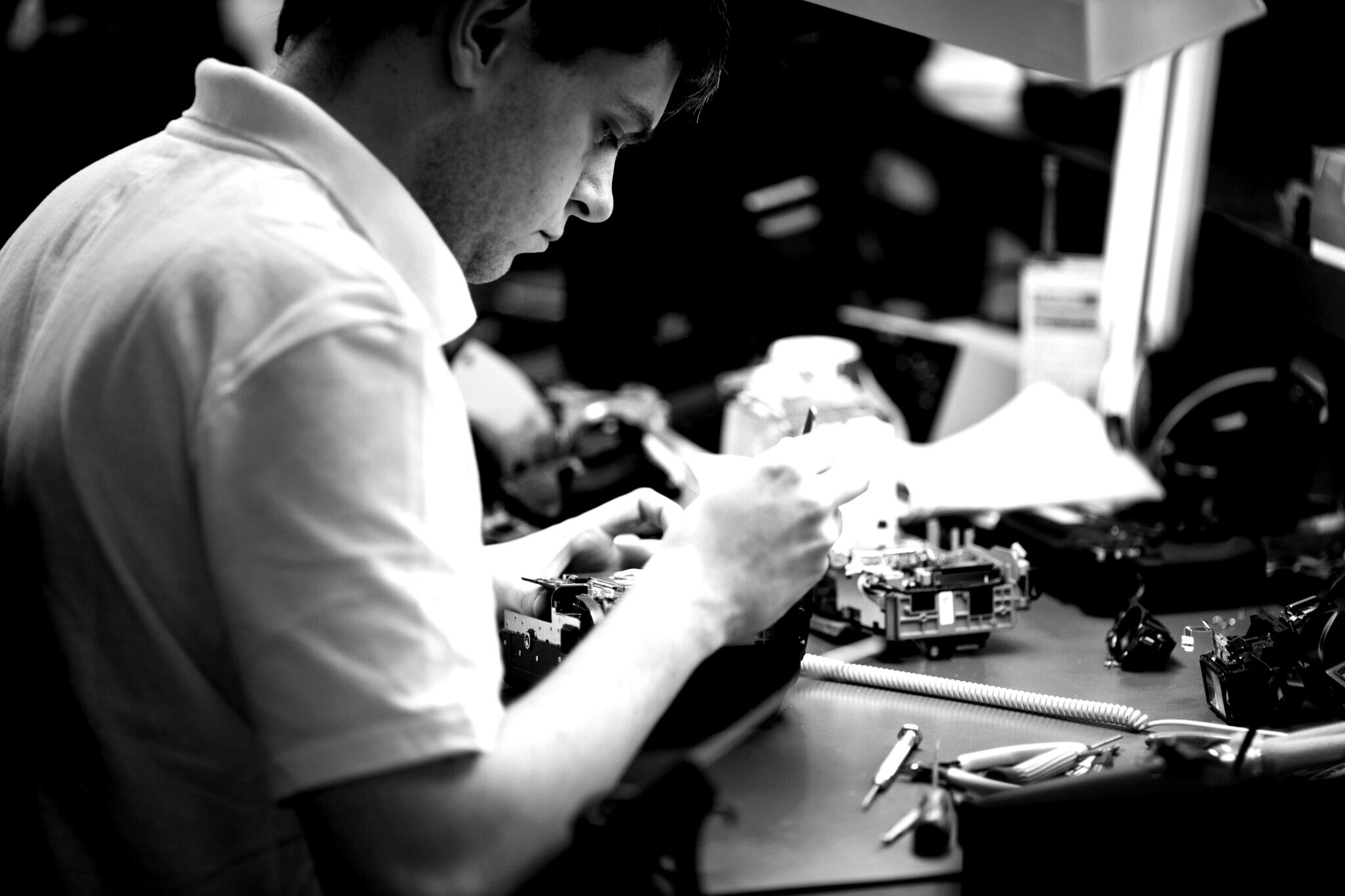 Technician repairing a camera